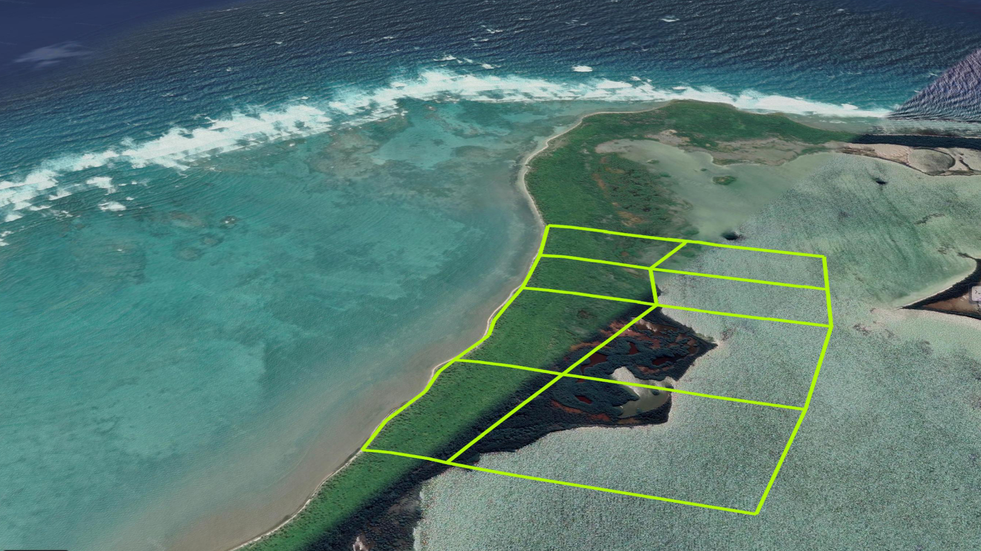 Aerial view of the Bacalar Beach parcel on the north Ambergris Caye, with surveyed lot boundaries marked along the Caribbean reef line.